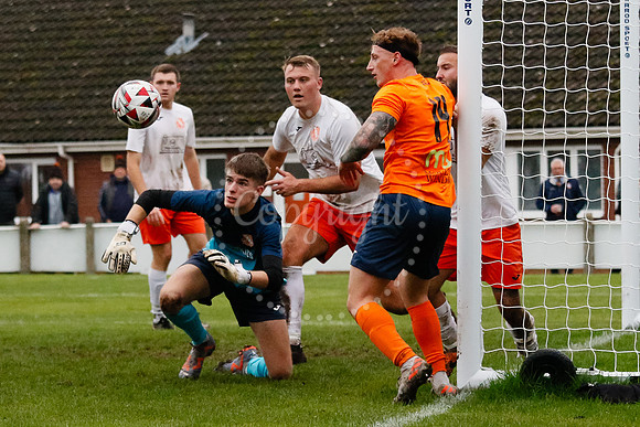 Football action from Diss Town hosting Holland FC.