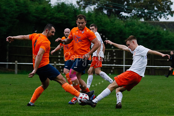 Football action from Diss Town hosting Holland FC.