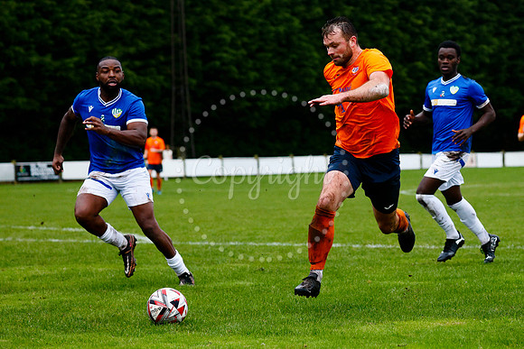 Football action from Diss Town vs FC Peterborough
